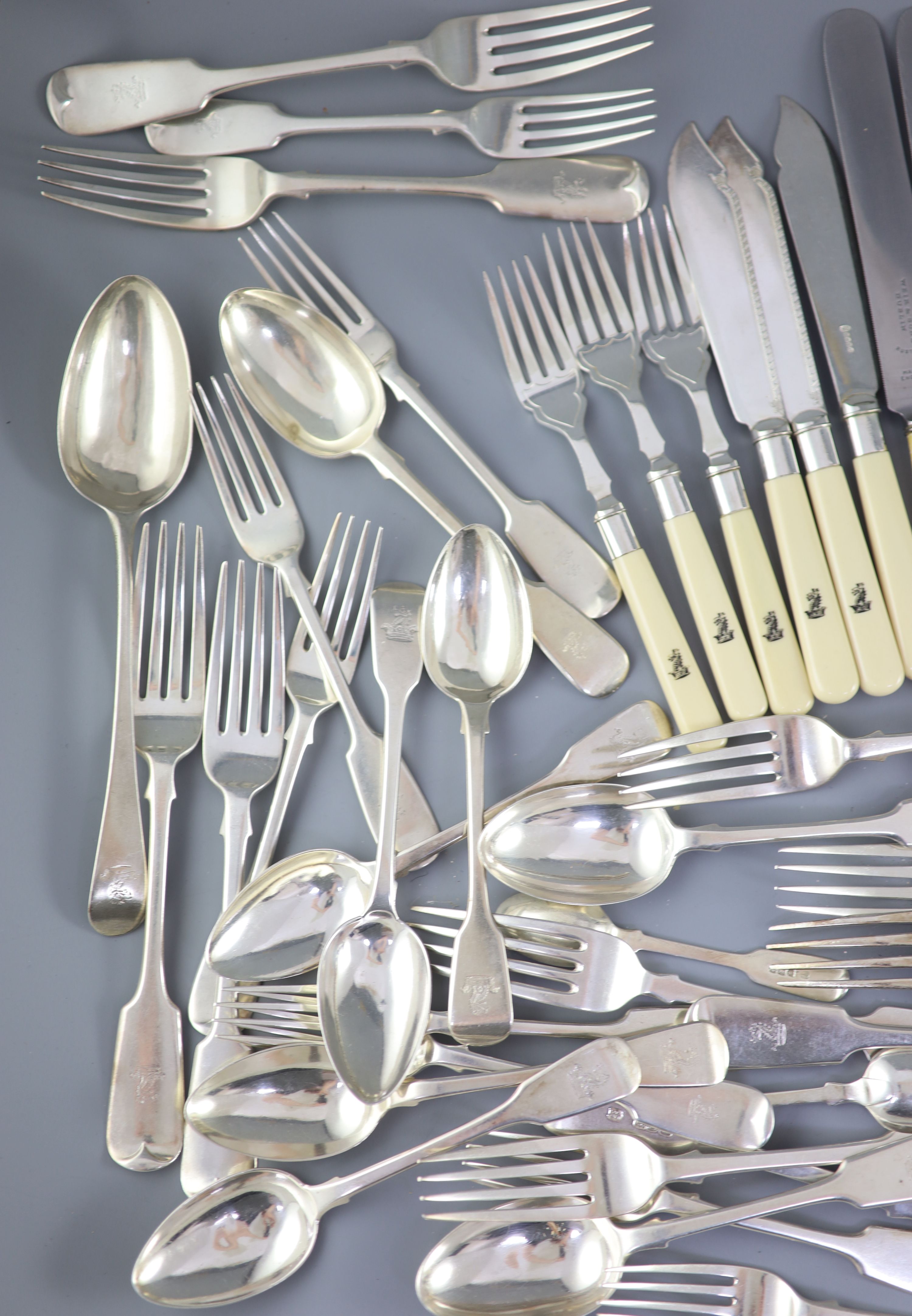 A 19th/20th century century harlequin canteen of silver fiddle and Old English pattern cutlery, comprising ninety seven items, mainly Josiah Williams & Co, London, 1900